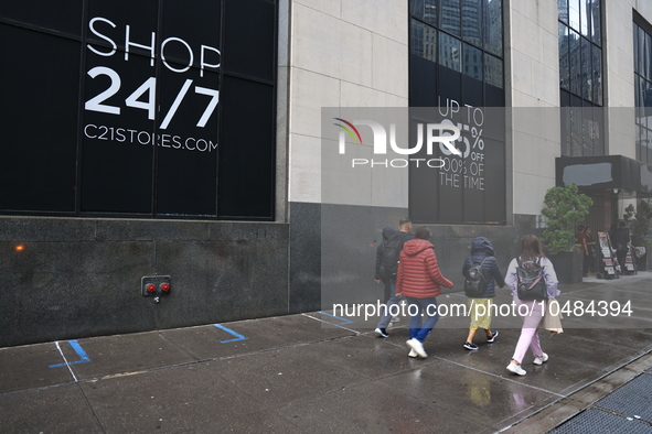 Pedestrians walk along Church Street outside of Century 21 in New York, New York, Saturday, Sept. 9, 2023. 