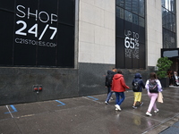 Pedestrians walk along Church Street outside of Century 21 in New York, New York, Saturday, Sept. 9, 2023. (