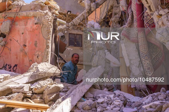 A man is searching for his belongings in what remains of his house in the city of Amizmiz, located just a few dozen kilometers from the epic...