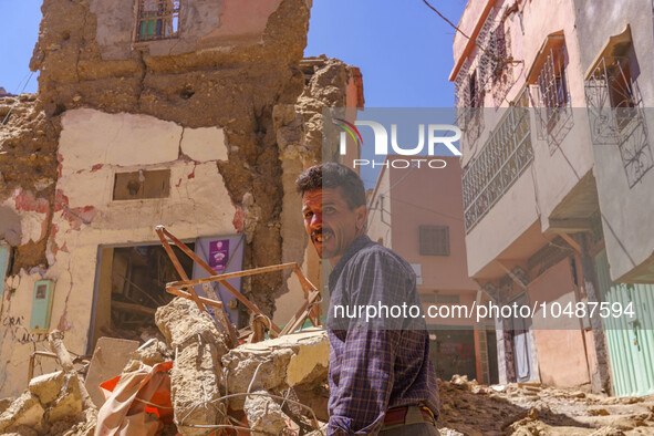 A man is searching for his belongings in what remains of his house in the city of Amizmiz, located just a few dozen kilometers from the epic...