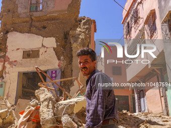 A man is searching for his belongings in what remains of his house in the city of Amizmiz, located just a few dozen kilometers from the epic...