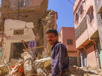 A man is searching for his belongings in what remains of his house in the city of Amizmiz, located just a few dozen kilometers from the epic...