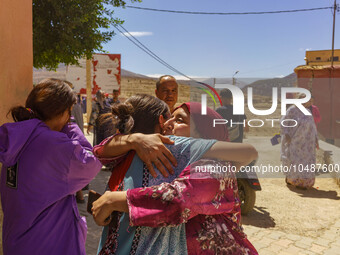 Two friends embrace each other after the earthquake destroyed their homes in Amizmiz, just a few dozen kilometers from the epicenter of the...