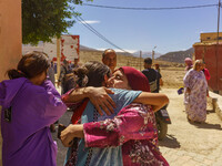 Two friends embrace each other after the earthquake destroyed their homes in Amizmiz, just a few dozen kilometers from the epicenter of the...