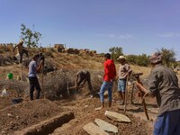 Men are digging graves to accommodate the earthquake victims in the village of Tafeghaghte, located just a few kilometers from the epicenter...