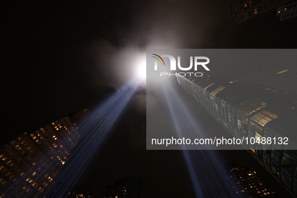 The Tribute in Light rises above the New York City skyline from the rooftop of where the installation was projected to commemorate the 9/11...