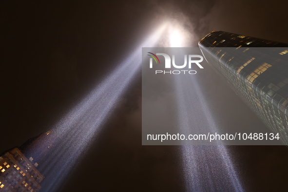 The Tribute in Light rises above the New York City skyline from the rooftop of where the installation was projected to commemorate the 9/11...