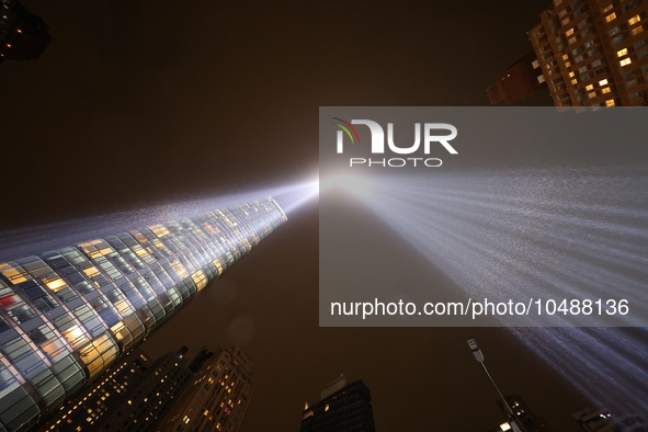 The Tribute in Light rises above the New York City skyline from the rooftop of where the installation was projected to commemorate the 9/11...