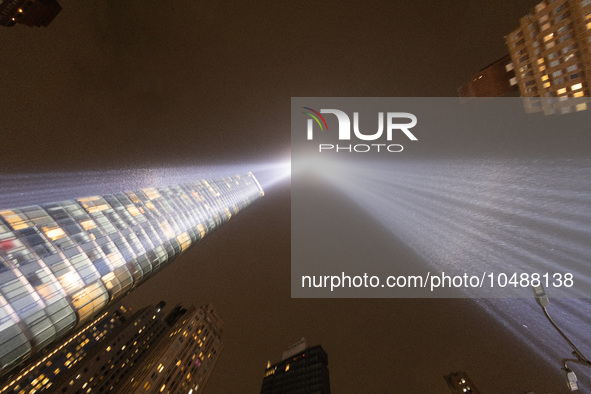 The Tribute in Light rises above the New York City skyline from the rooftop of where the installation was projected to commemorate the 9/11...