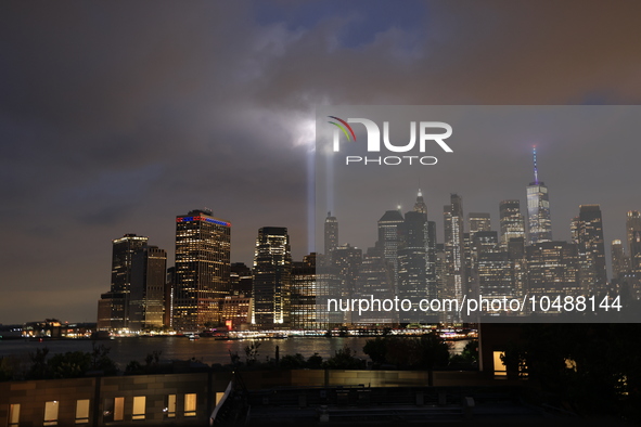 The Tribute in Light rises above the New York City skyline from Brooklyn to commemorate the 9/11 Anniversary in New York, New York, Sunday,...