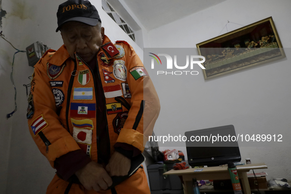 Hector Mendez, better known as El Chino, head and founder of the Azteca Topos International Rescue Brigade, gets ready at his home before tr...