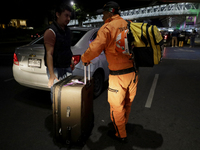 Hector Mendez, better known as El Chino, head and founder of the Azteca Topos International Rescue Brigade, arrives at the Mexico City Inter...