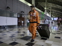 Hector Mendez, better known as El Chino, head and founder of the Azteca Topos International Rescue Brigade, arrives at the Mexico City Inter...