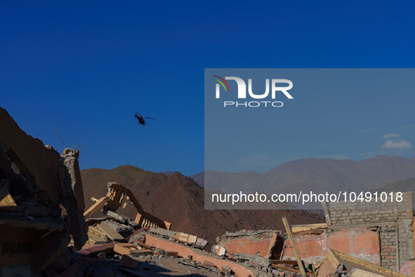 A helicopter is flying over the earthquake-stricken areas in the Al Haouz region, at the foothills of the High Atlas Mountains. 