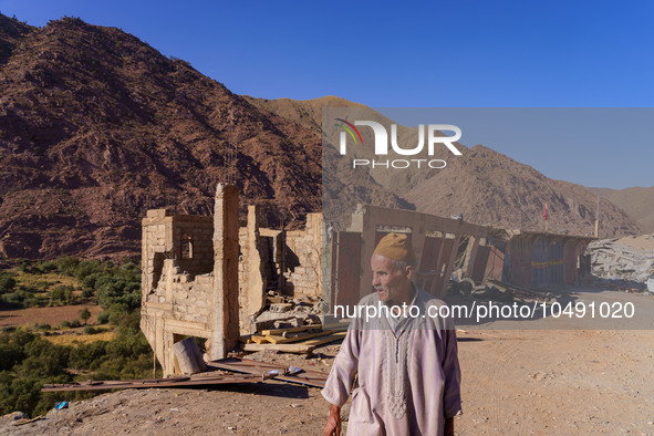 A man walks past the ruins of homes destroyed by the earthquake in the village of Ijoukak, which was completely flattened by the earthquake....