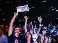 People are catching false Polish banknotes during the Confederation Liberty and Independence party (Konfederacja) pre-election rally in Krak...