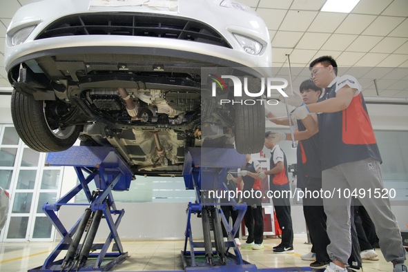 YANTAI, CHINA - SEPTEMBER 8, 2023 - Students conduct a training on vehicle maintenance at Yantai Vocational College of Culture and Tourism,...