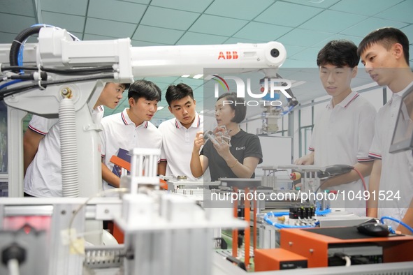 YANTAI, CHINA - SEPTEMBER 8, 2023 - Students conduct an industrial robot training at Yantai Cultural and Tourism Vocational College in Yanta...