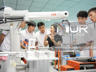 YANTAI, CHINA - SEPTEMBER 8, 2023 - Students conduct an industrial robot training at Yantai Cultural and Tourism Vocational College in Yanta...