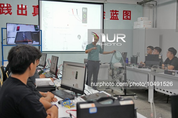 YANTAI, CHINA - SEPTEMBER 8, 2023 - Students conduct a training on vehicle maintenance at Yantai Vocational College of Culture and Tourism,...