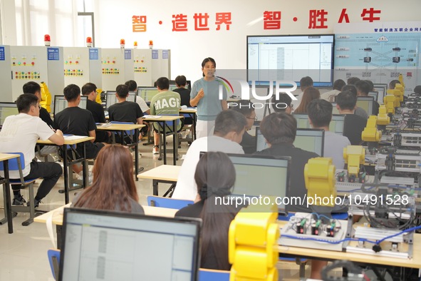 YANTAI, CHINA - SEPTEMBER 8, 2023 - Students conduct an industrial robot training at Yantai Cultural and Tourism Vocational College in Yanta...