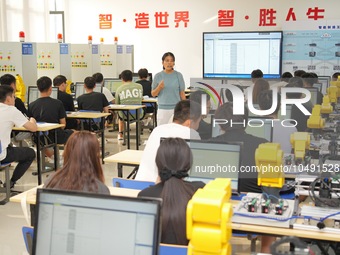 YANTAI, CHINA - SEPTEMBER 8, 2023 - Students conduct an industrial robot training at Yantai Cultural and Tourism Vocational College in Yanta...