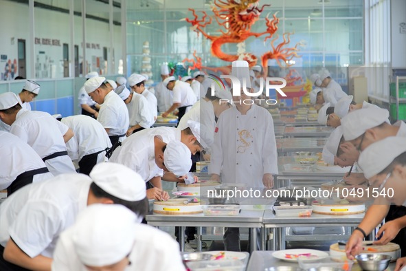 YANTAI, CHINA - SEPTEMBER 8, 2023 - Students have a cooking training at Yantai Vocational College of Culture and Tourism in East China's Sha...