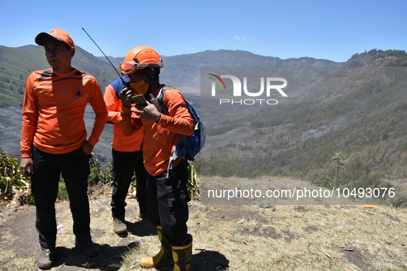 Some of  officer monitors hotspots on the slopes of a mountain that have been burning since mid-August during the dry season in the Bromo Te...