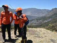 Some of  officer monitors hotspots on the slopes of a mountain that have been burning since mid-August during the dry season in the Bromo Te...