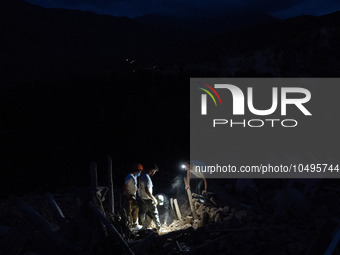 A foreign rescue team digs in search of survivors in the remote village of Imi N'Tala, located 75 kilometers southwest of Marrakesh. (