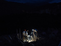 A foreign rescue team digs in search of survivors in the remote village of Imi N'Tala, located 75 kilometers southwest of Marrakesh. (