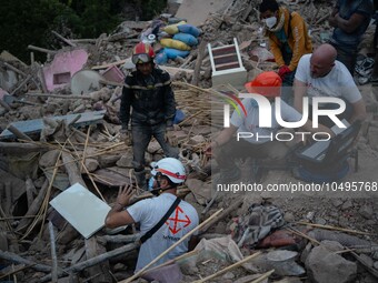 A foreign rescue team inspects the rubble of the houses destroyed by the earthquake in the remoted village of Imi N'Tala, located 75 kilomet...