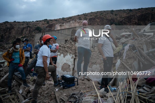 A foreign rescue team inspects the rubble of the houses destroyed by the earthquake in the remoted village of Imi N'Tala, located 75 kilomet...