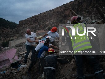 A foreign rescue team digs in search of survivors in the remote village of Imi N'Tala, located 75 kilometers southwest of Marrakesh. (