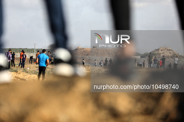 Palestinian protesters during clashes with Israeli forces in a demonstration along the border between the Gaza Strip and Israel, east of Gaz...