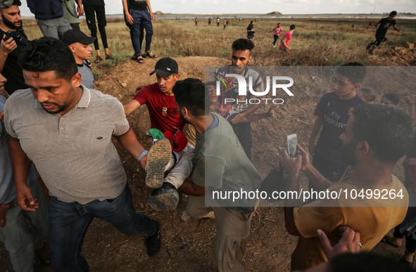 An injured Palestinian protestor is carried away following clashes with Israeli security forces along the Gaza-Israel border east of Gaza Ci...