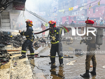 Firefighters try to extinguish a fire that broke out, at the Mohammadpur Krishi Market in Dhaka, Bangladesh, on September 14, 2023.
 (