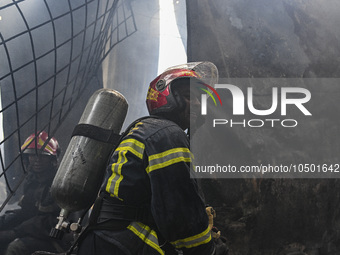 Firefighters try to extinguish a fire that broke out, at the Mohammadpur Krishi Market in Dhaka, Bangladesh, on September 14, 2023.
 (