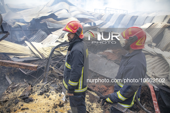 Firefighters stay  alart at Mohammadpur Krishi Market in Dhaka on September 14, 2023. A massive blaze has gutted shops in Dhaka's Mohammadpu...