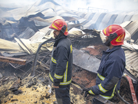 Firefighters stay  alart at Mohammadpur Krishi Market in Dhaka on September 14, 2023. A massive blaze has gutted shops in Dhaka's Mohammadpu...