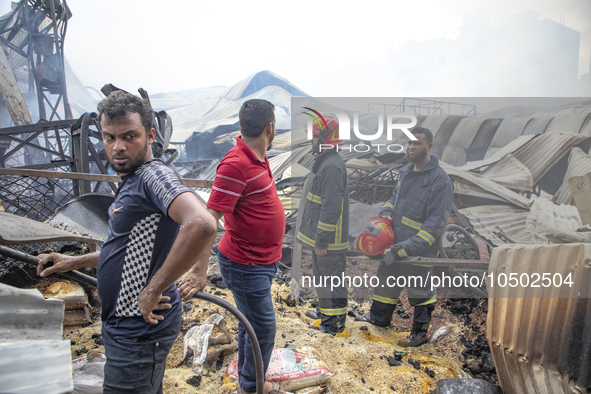 Firefighters stay  alart at Mohammadpur Krishi Market in Dhaka on September 14, 2023. A massive blaze has gutted shops in Dhaka's Mohammadpu...