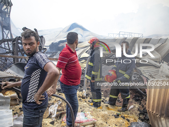 Firefighters stay  alart at Mohammadpur Krishi Market in Dhaka on September 14, 2023. A massive blaze has gutted shops in Dhaka's Mohammadpu...