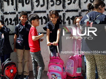 Children  wait in front of a school as the 2023-2024 academic year begins for Tunisian students after the summer holiday in Tunis, Tunisia o...