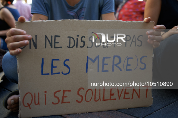 A cardboard reads 'One can't dissolve Mothers who rise up'. Extinction Rebellion (XR) Toulouse organized a sit-in of women in one of the mos...