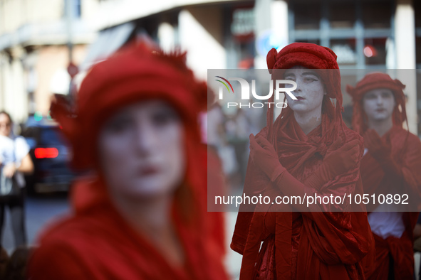 Red Rebels during the sit-in. Extinction Rebellion (XR) Toulouse organized a sit-in of women in one of the most frequented street of Toulous...