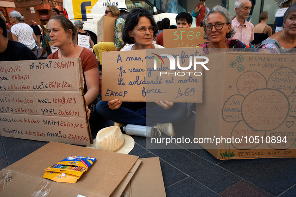 The woman in the middle holds a placard reading 'To my, yours, ours children, I want to keep hope. Solidarity is our strenght'. Extinction R...