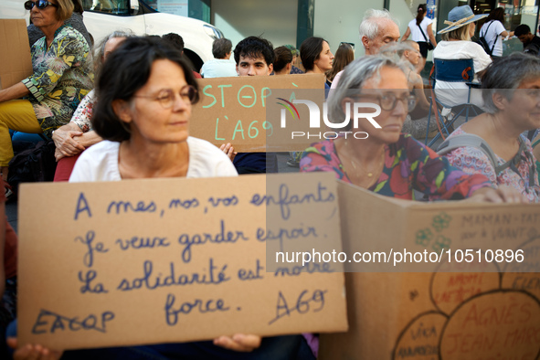 A young man holds a placard reading 'Stop to the A69'. Extinction Rebellion (XR) Toulouse organized a sit-in of women in one of the most fre...