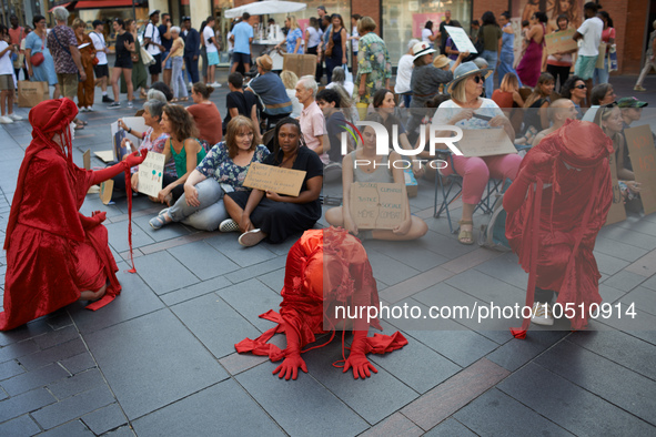 Red Rebels in front of the sit-in. Extinction Rebellion (XR) Toulouse organized a sit-in of women in one of the most frequented street of To...