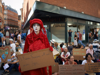 A red Rebel reads 'To Remi Fraisse, 21yo, my age' in front of the sit-in. Extinction Rebellion (XR) Toulouse organized a sit-in of women in...