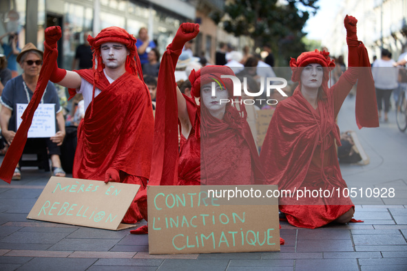 Red Rebels in front of the sit-in. Extinction Rebellion (XR) Toulouse organized a sit-in of women in one of the most frequented street of To...